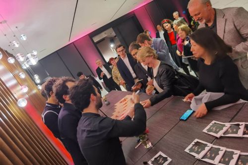 Visitors to a classical music concert at the autograph session