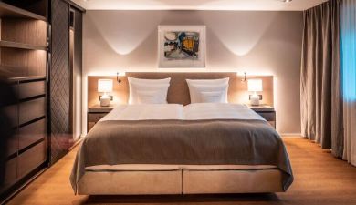 dimmed light in a bedroom with a dark wood closet